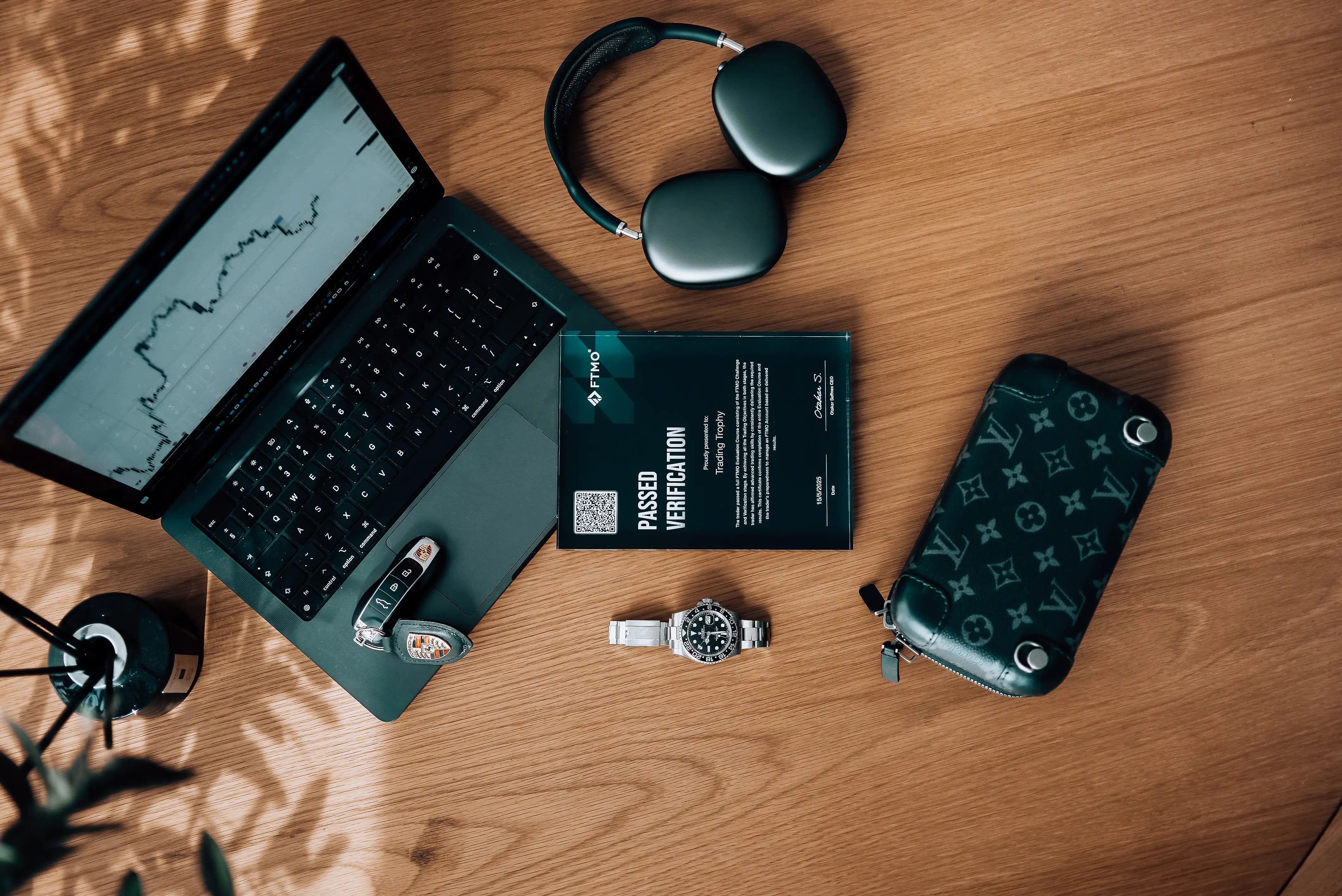 trading trophy with luxury rolex watch and key's porsche on table