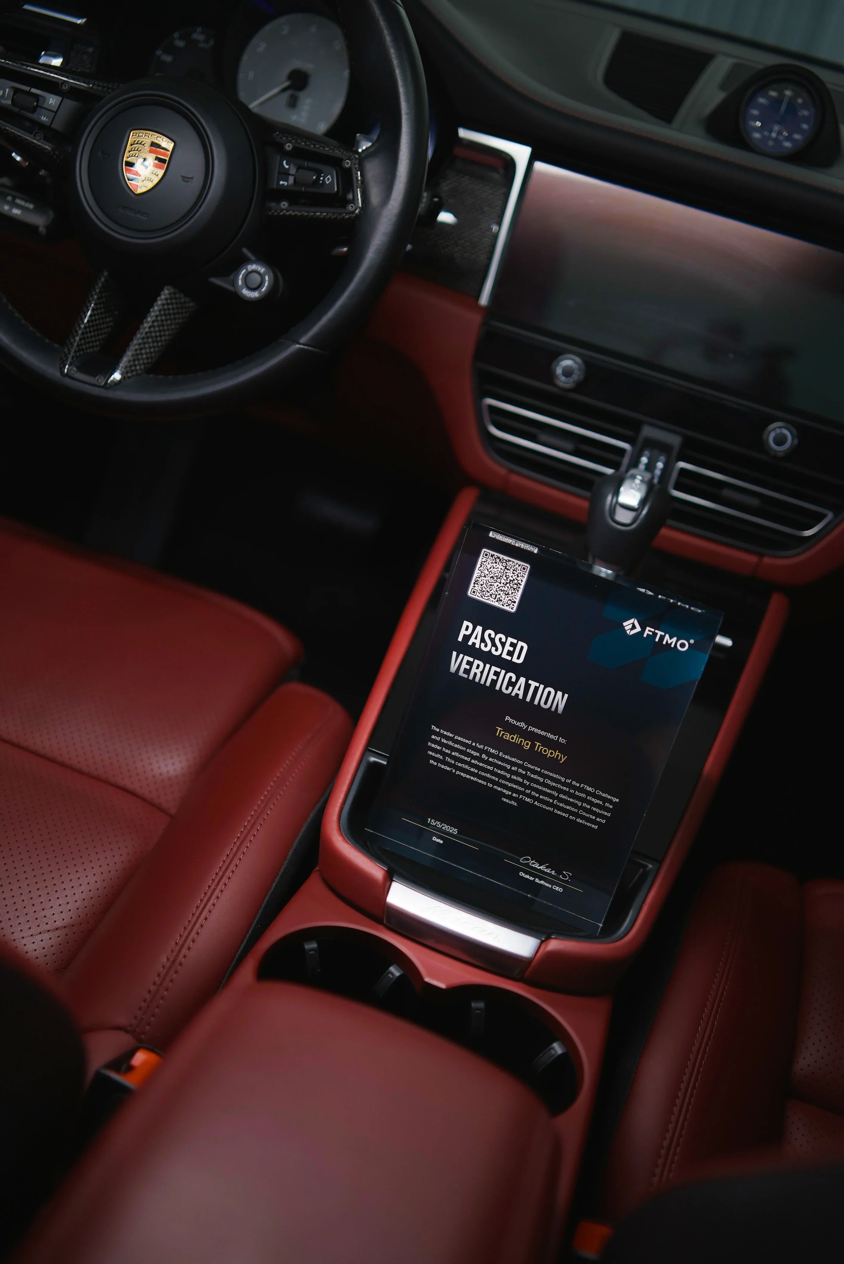trading trophy in a luxury car porsche